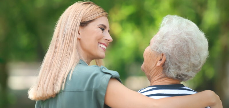 Daughter talking with aging mother