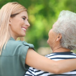 Daughter talking with aging mother
