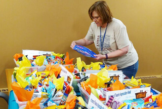woman putting together teacher gifts