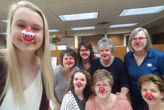 woman putting together teacher gifts