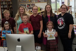 80s arcade parade float with BaZing and KaChing arcade games on them