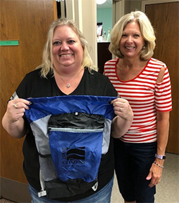 woman putting together teacher gifts