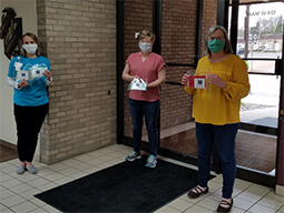 first citizens employees holding donated masks